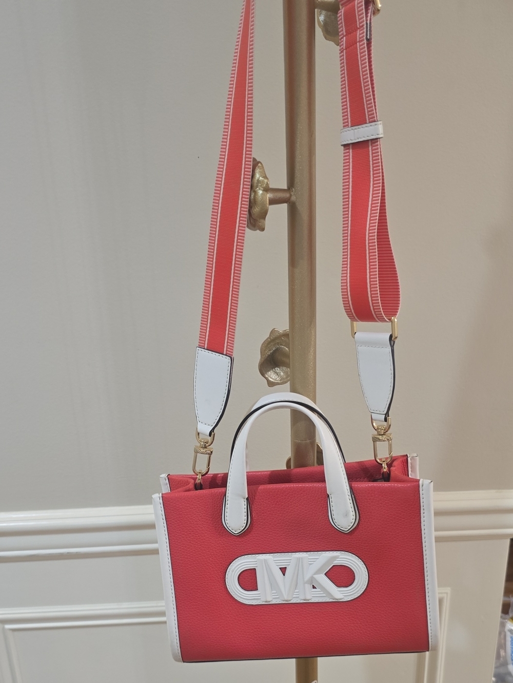 Michael Kors Coral Pink Leather Crossbody with White Trim and Striped Strap